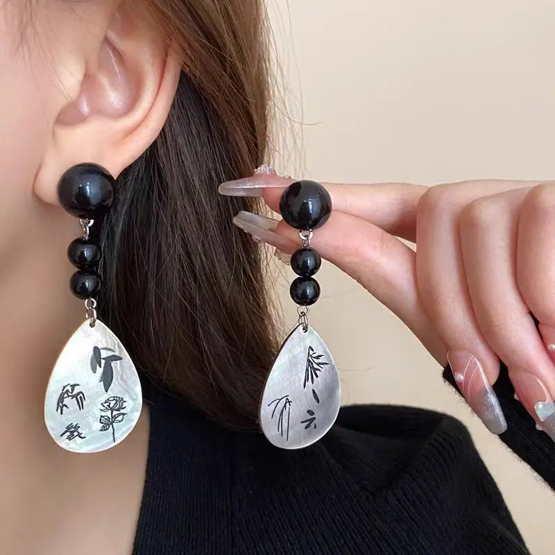 Steel Fan Tassel Earrings