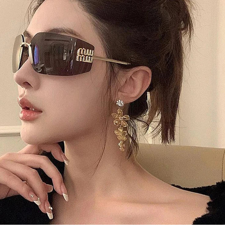 MUI MUI CURVED LUXURY SUNGLASSES